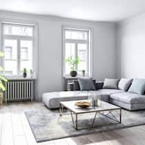 Spacious empty living room with wooden flooring