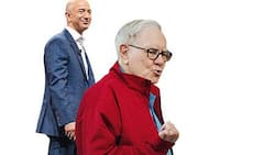 Glauben an die Printmedien: Jeff Bezos (l.), Warren Buffett.
