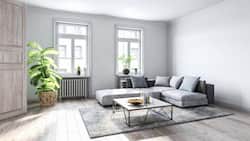 Spacious empty living room with wooden flooring