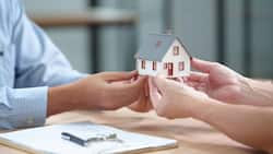 Real Estate Deal with House Model, Documents and Keys