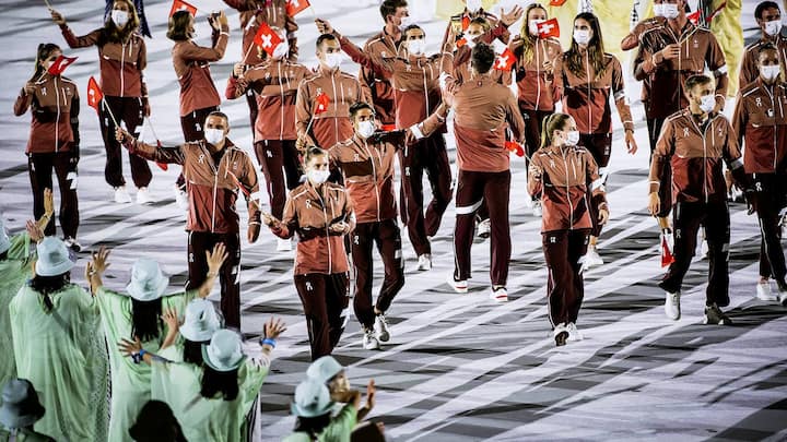 Swiss athletes parade during the opening ceremony of the 2020 Tokyo Summer Olympics at the National Stadium in Tokyo, Japan, Friday, July 23, 2021. (KEYSTONE/Laurent Gillieron)