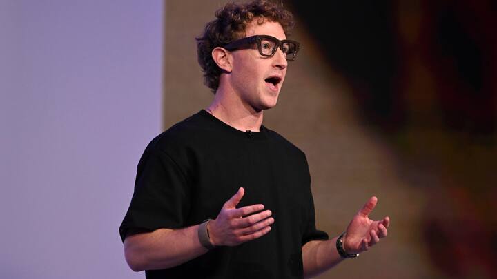 Meta CEO Mark Zuckerberg wears artificial intelligence-powered smart glasses and a wristband as he speaks during the company's Connect developer conference Wednesday, Sept. 17, 2025, in Menlo Park, Calif. (AP Photo/Nic Coury)