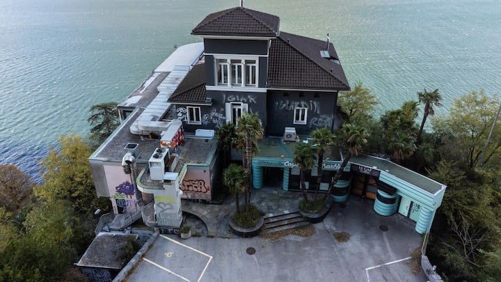 Aerial view of Capo San Martino, a prestigious building overlooking Lake Ceresio, now in a state of neglect but with a redevelopment project by architect and FC Sion president Christian Constantin, in Paradiso, Switzerland, Sunday, October 26, 2025. (KEYSTONE/Ti-Press/Massimo Piccoli)