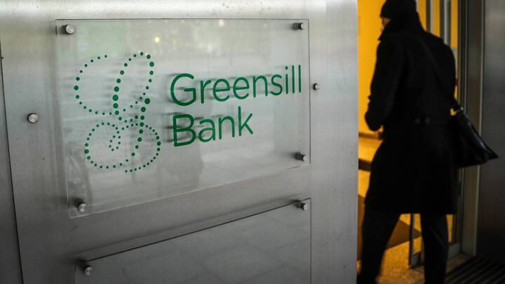 epa09050565 A person enters the Greensill Bank in Bremen, northern Germany, 04 March 2021. The German Federal Financial  Supervisory Authority (BaFin) has banned the bank from regular operations on 03 March due to the threat of over-indebtedness.  EPA/FOCKE STRANGMANN