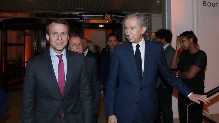 PARIS, FRANCE - DECEMBER 03: Emmanuel Macron and Bernard Arnault arrive at the 'Volez, Voguez, Voyagez - Louis Vuitton' Exhibition Opening  at Le Grand Palais on December 3, 2015 in Paris, France.  (Photo by Rindoff/Le Segretain/Getty Images for Louis Vuitton)
