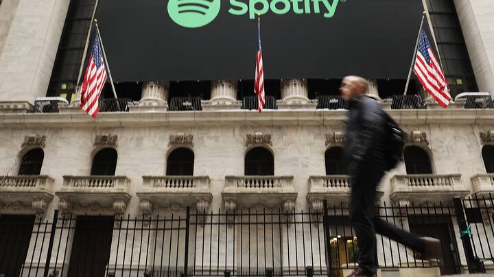 NEW YORK, NY - APRIL 03:  People walk by  the New York Stock Exchange (NYSE) on the morning that the music streaming service Spotify begins trading shares at the NYSE on April 3, 2018 in New York City.  Trading under the symbol SPOT, the Swedish company's losses grew to 1.235 billion euros ($1.507 billion) last year, its largest ever.  (Photo by Spencer Platt/Getty Images)