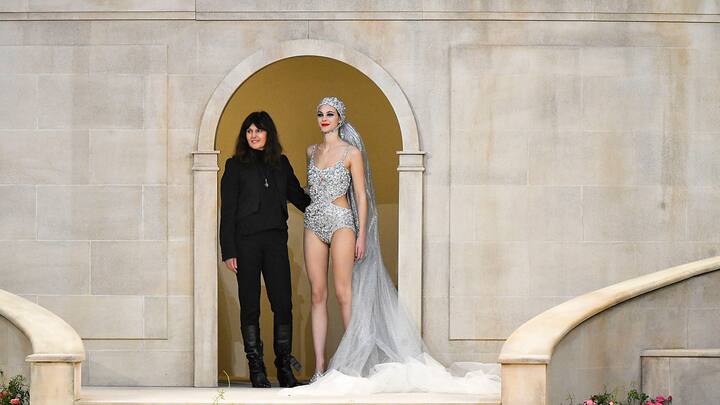 PARIS, FRANCE - JANUARY 22: Fashion designer Virginie Viard and Vittoria Ceretti walk the runway during the Chanel Haute Couture Spring Summer 2019 fashion show as part of Paris Fashion Week on January 22, 2019 in Paris, France. (Photo by SAVIKO/Gamma-Rapho via Getty Images)