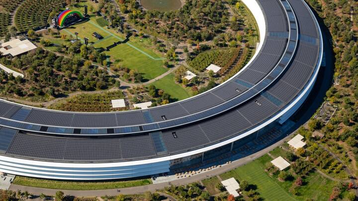 The Apple Park campus stands in this aerial photograph taken above Cupertino, California, U.S., on Wednesday, Oct. 23, 2019. Apple Inc. will report its fourth-quarter results next week, and based on the average analyst price target for the stock, Wall Street is feeling increasingly optimistic about the iPhone maker's prospects. Photographer: Sam Hall/Bloomberg