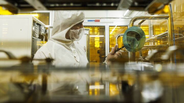 A technician inspects a semiconductor wafer during testing in the cleanroom at the Tower Semiconductor Ltd. plant in Migdal HaEmek, Israel, on Monday, Feb. 28, 2022. Intel Corp. agreed to acquire Tower Semiconductor for about $5.4 billion, part of Chief Executive Officer Pat Gelsingers push into the outsourced chip-manufacturing business. Photographer: Kobi Wolf/Bloomberg