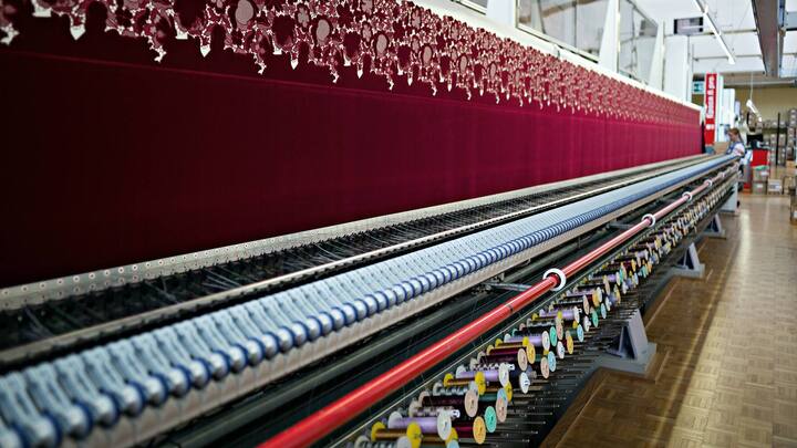 An embroidery machine, manufactured by Saurer AG, embroiders a textile in the stitching hall at the Forster Rohner AG textile production workshop in St Gallen, Switzerland, on Wednesday, May 31, 2017. Forster Rohner, a 113-year-old company in the eastern city of St. Gallen, produces fabric that can cost thousands of dollars per yardincluding material used in the dress that British socialite Pippa Middleton wore at her wedding in May. Photographer: Michele Limina/Bloomberg via Getty Images