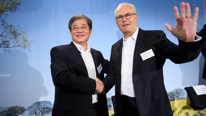 Ren Jianxin, left, chairman of ChemChina and futur  Chairman of Syngenta shakes hand with Michel Demare, right, futur vice-chairman and lead independent director of Syngenta during a press conference of Syngenta after its acquisition by ChemChina, in Basel, Tuesday, June 27, 2017. The China National Chemical Corporation, or &#x201a;"ChemChina" has acquired the worlds biggest producer of agricultural chemicals, the Swiss agribusiness company Syngenta AG. (KEYSTONE/Laurent Gillieron)