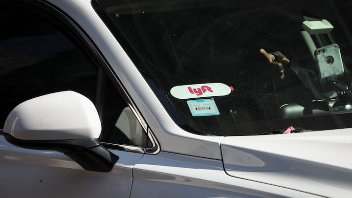 NEW YORK, NY - MARCH 19: A Lyft logo is displayed on a vehicle driving through Times Square, March 19, 2019 in New York City. Lyft, the popular ride-hailing service and competitor to Uber, is planning its initial public offering (IPO) on the NASDAQ stock exchange in the coming weeks. Lyft is projecting investors will buy the stock for between $62 and $68 per share, with the company expecting to raise over $2 billion through the sale of stock. (Photo by Drew Angerer/Getty Images)