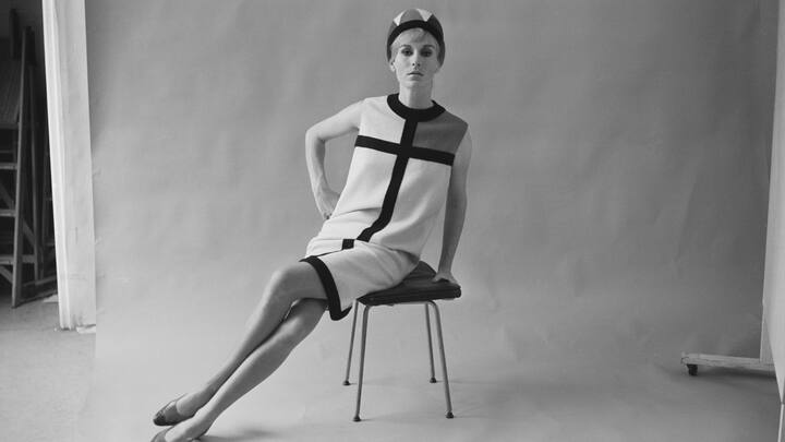 A model wearing a day dress from the Mondrian collection of French fashion designer Yves Saint Laurent, 23rd August 1965. The collection was inspired by the paintings of Piet Mondrian. (Photo by Terry Fincher/Express/Hulton Archive/Getty Images)