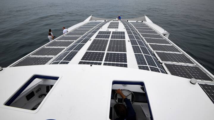 This photo taken on June 23, 2017 shows the the self-energy producing multihull "Energy Observer," off the coasts of Saint-Malo, western France. - The Energy Observer, an autonomous boat powered by hydrogen and renewable energy, is in preparation for a world tour in six years. (Photo by DAMIEN MEYER / AFP)