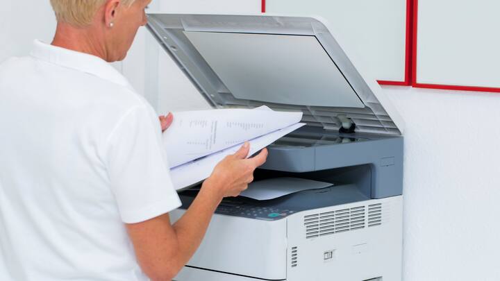 Nurse at work...using photocopier,copiing medical results