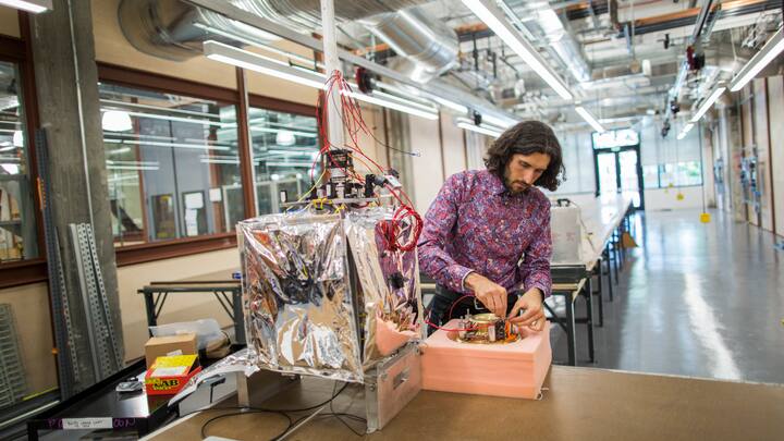 Christopher Schuster, Manager of The Project Loan Lab at Google, works on a flight electronics system for the Loon balloons inside the top secret Google X research lab. (Photo by Brooks Kraft LLC/Corbis via Getty Images)