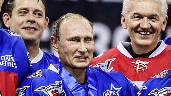 SOCHI, RUSSIA - OCTOBER 07: (L-R): Former NHL player Pavel Bure, Russian President Vladimir Putin, businessman and billionaire Gennady Timchenko attend an ice hockey match of the Night Hockey League on October 7, 2015 in Sochi, Russia. Putin spends his 63-th birthday playing hockey with NHL stars. (Photo by Sasha Mordovets/Getty Images)