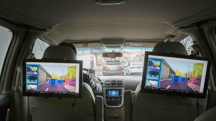 Screens show a demonstration of the cognition level of Horizon Robotics Inc.'s Journey processor onboard a vehicle during a test drive in Beijing, China, on Friday, March 23, 2018. China's aspiration to deploy 30 million autonomous vehicles within a decade is seeding a fledgling chip industry, with startups like Horizon Robotics emerging to build the brains behind those wheels. Photographer: Giulia Marchi/Bloomberg