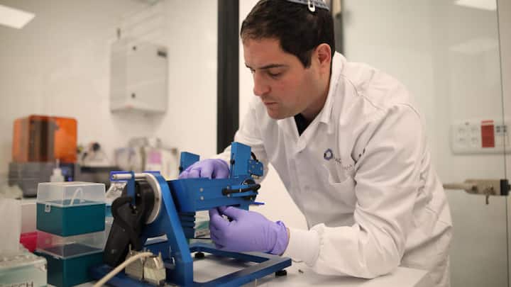 Director of Research Yair Glick adjusts a 'Lab-on-a-Chip' onto a device that simulates microgravity, in the SpacePharma facilities in Herzliya near Tel Aviv, March 04, 2019.