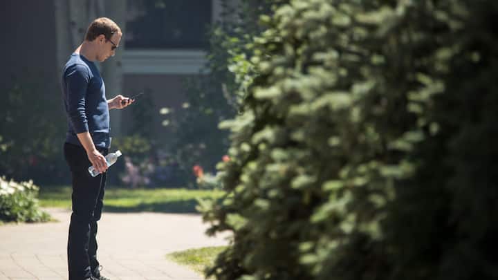 SUN VALLEY, ID - JULY 13: Mark Zuckerberg, chief executive officer of Facebook, checks his phone during the annual Allen & Company Sun Valley Conference, July 13, 2018 in Sun Valley, Idaho. Every July, some of the world's most wealthy and powerful businesspeople from the media, finance, technology and political spheres converge at the Sun Valley Resort for the exclusive weeklong conference. (Photo by Drew Angerer/Getty Images)