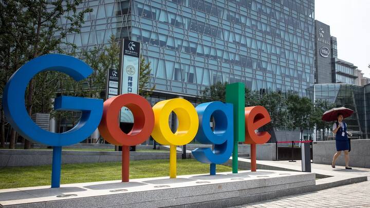 epa06994628 (FILE) - A Chinese woman walks past a 'Google' brand name and logo, near the Google office in Beijing, China, 03 August 2018 (reissued 03 September 2018). Google marks its 20th anniversary on 04 September 2018, the date in 1998 when Google founders Larry Page and Sergey Brin incorporated the company. The stock market value of Alphabet (parent company of Google) currently is 688 billion USD.  EPA/ROMAN PILIPEY
