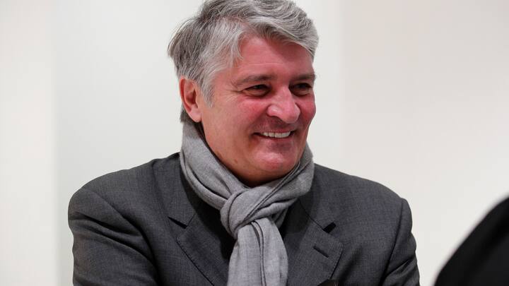 Former CEO of Global Wealth Management and Business Banking at UBS AG Raoul Weil shares a laugh with his lawyer during a break of the Swiss bank's trial at the Paris courthouse in Paris, Wednesday, Nov. 14, 2018. Swiss bank UBS AG stand trial in France for allegedly helping wealthy French clients evade the country's tax authorities. (AP Photo/Francois Mori)