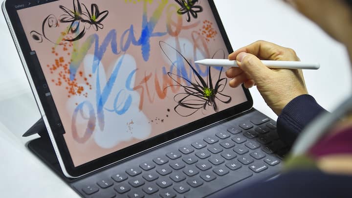 Japanese artist Mako Oke draws on the new iPad Pro using its pencil accessory after an event announcing new products Tuesday Oct. 30, 2018, in the Brooklyn borough of New York. (AP Photo/Bebeto Matthews)