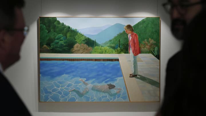 Visitors watch the painting "Portrait of an artist (pool with two figures)" by David Hockney during a media preview by the Christie's auction house in Hong Kong Thursday, Sept. 27, 2018. The painting is expected to fetch US$80 million at the Christie's New York evening sale in November. (AP Photo/Kin Cheung)