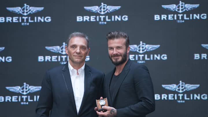 President and CEO of Breitling SA Theodore Schneider (L) and David Beckham attend a commerical event on June 12, 2014 in Beijng, China