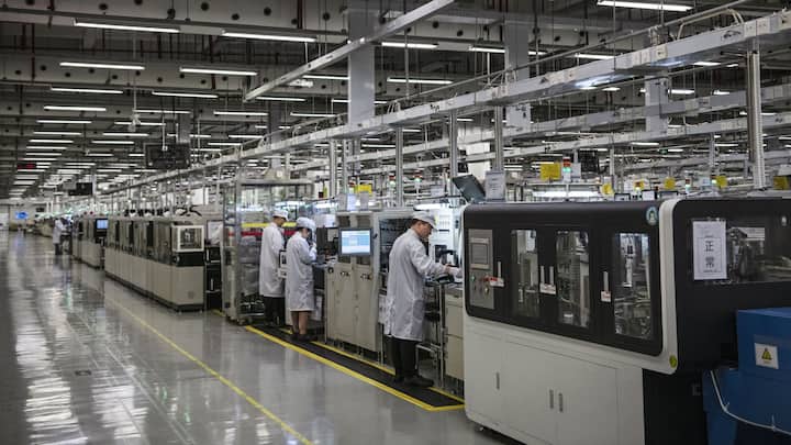 Workers are seen on the production line at Huawei's production campus on April 11, 2019 in Dongguan, near Shenzhen, China. 