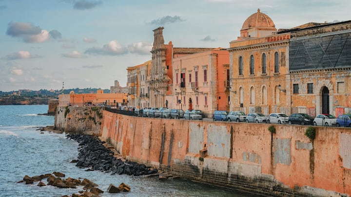Embankment at old city in Siracusa and Mediterranean sea Sicily