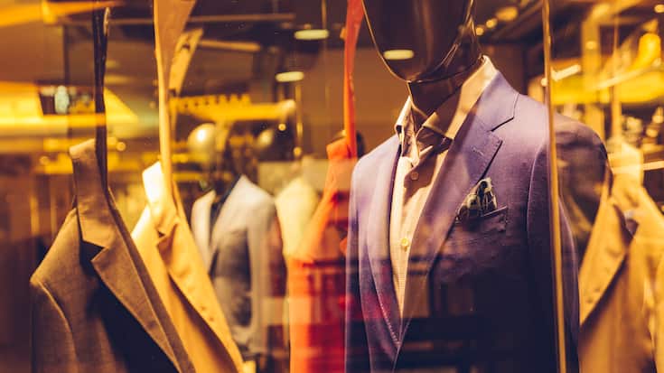 business suits in display window.