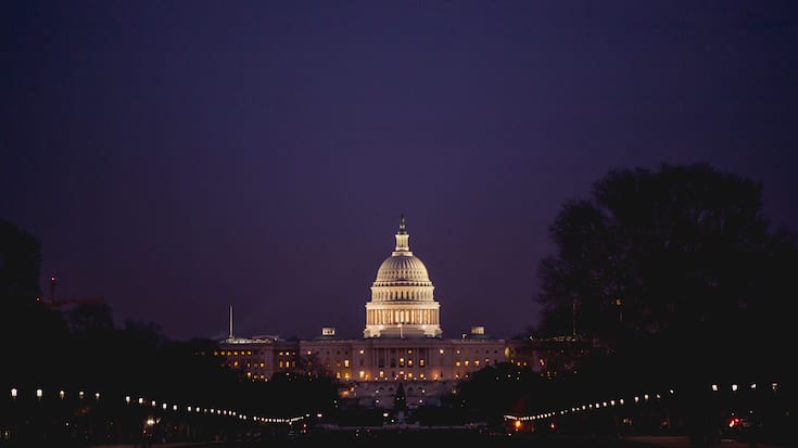 The U.S. Capitol building in Washington DC at night 