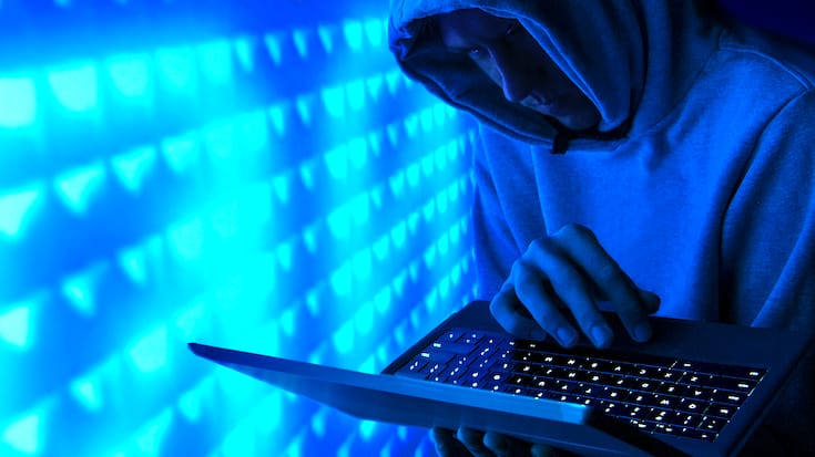 hooded computer hacker