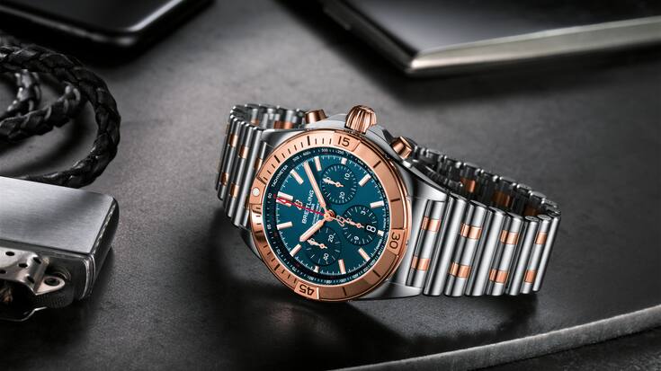 Two-tone Chronomat B01 42 with a blue dial and tone-on-tone chronograph counters highlighted by an 18 k red gold bezel, crown and pushers