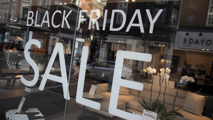 Shoppers on Oxford Street in central London with a sign advertising Black Friday in a shop window on 25th November 2017 in London, England, United Kingdom. This is the busiest shopping district in the capital with Oxford Street being Europe's busiest shopping area. (photo by Mike Kemp/In Pictures via Getty Images)