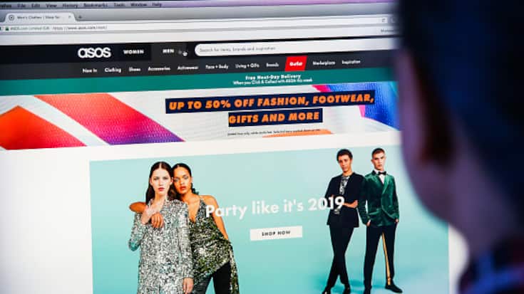 LONDON, UNITED KINGDOM - 2018/12/17: A woman is seen shopping on ASOS the online fashion store on a desktop. Shares in Asos tumbled nearly 40 per cent on Monday morning after the online fashion retailer warned of weak profits this financial year after "unprecedented" discounting hit its trading in November. (Photo by Dinendra Haria/SOPA Images/LightRocket via Getty Images)