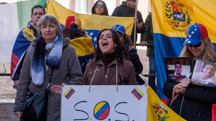 The Venezuelan community in Italy demonstrates in support of Juan Guaido and the people of the Bolivarian Republic of Venezuela and against Venezuelan president Nicolas Maduro in front Parliament on February 06, 2019 in Rome, Italy. (Photo by Stefano Montesi - Corbis/Getty Images)