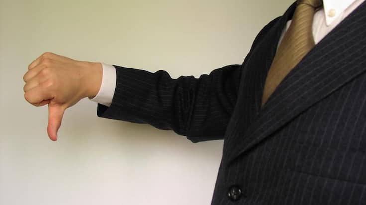 1729-business-man-in-a-suit-giving-thumbs-down-or.jpg