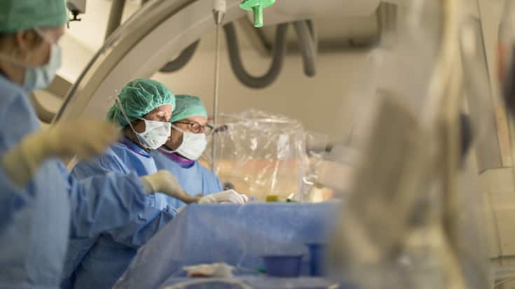 Prof. Dr. med. Isabel Wanke and Prof. Dr. med. Daniel Ruefenacht perform endovascular coiling to treat a brain aneurysm in the NeuroSuite operating theater at the Hirslanden Hospital in Zurich, Switzerland, on April 9, 2015. 