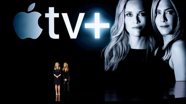 Actresses Reese Witherspoon, left, and Jennifer Aniston speak at the Steve Jobs Theater during an event to announce new products Monday, March 25, 2019, in Cupertino, Calif. (AP Photo/Tony Avelar)