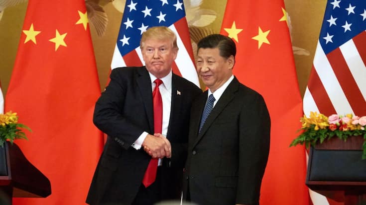 US President Donald Trump (L) and China's President Xi Jinping shake hands at a press conference following their meeting at the Great Hall of the People in Beijing. Artyom Ivanov/TASS (Photo by Artyom Ivanov\TASS via Getty Images)