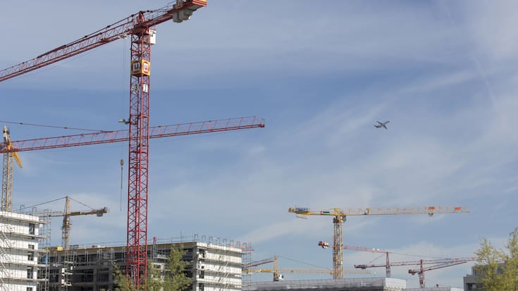 The large construction site "Glattpark" in Opfikon, Zurich, Switzerland, pictured with an aeroplane in the sky, on April 11, 2014. (KEYSTONE/Gaetan Bally)