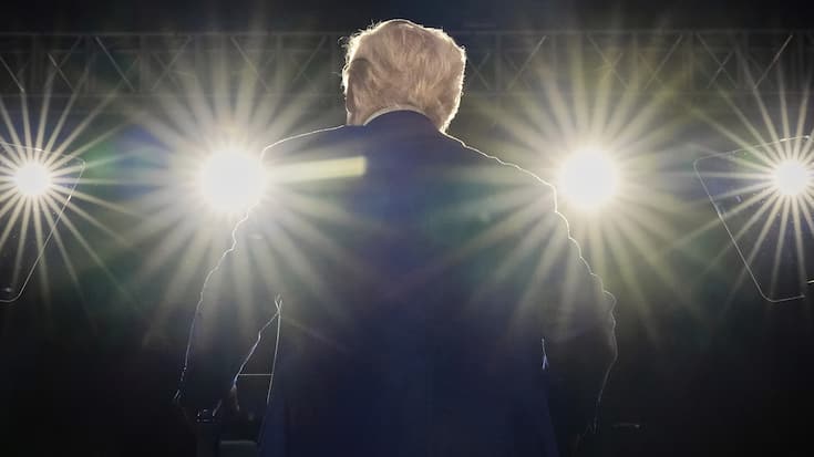 President Donald Trump smiles on stage at the Al Udeid Air Base, Thursday, May 15, 2025, in Doha, Qatar. (AP Photo/Alex Brandon)