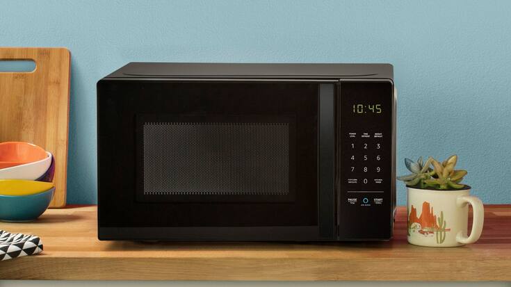 This undated photo provided by Amazon shows a new microwave oven that connects with Amazon's Echo devices. Amazon wants the most basic of tasks to be controlled by voice, from microwaving potatoes to switching up the music in the car. The company unveiled several gadgets on Thursday, Sept. 20, 2018, furthering Amazon's goal of placing its Alexa voice assistant everywhere its customers are. (Amazon via AP)