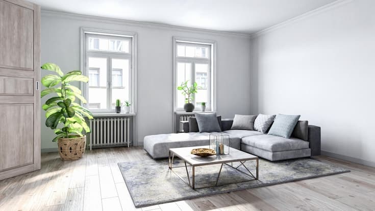 Spacious empty living room with wooden flooring