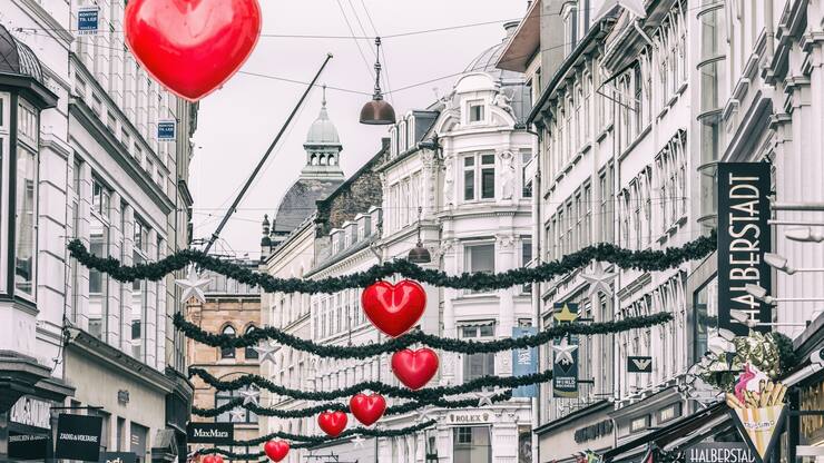 Heart shaped Christmas decorations and buildings in StrÃ¸get street