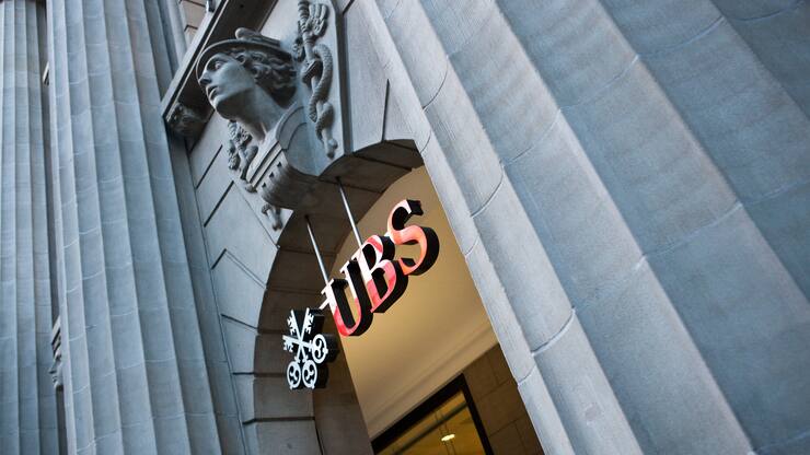 A relief sculpture hangs above the entrance to the UBS headquarters on Bahnhofstrasse in Zurich, Switzerland, on Tuesday, Feb. 9, 2010. UBS AG, the European bank with the biggest losses from the credit crisis, said withdrawals by wealthy clients accelerated in the fourth quarter, even as thecompany reported its first profit in more than a year. Photographer: Reto Andreoli/Bloomberg