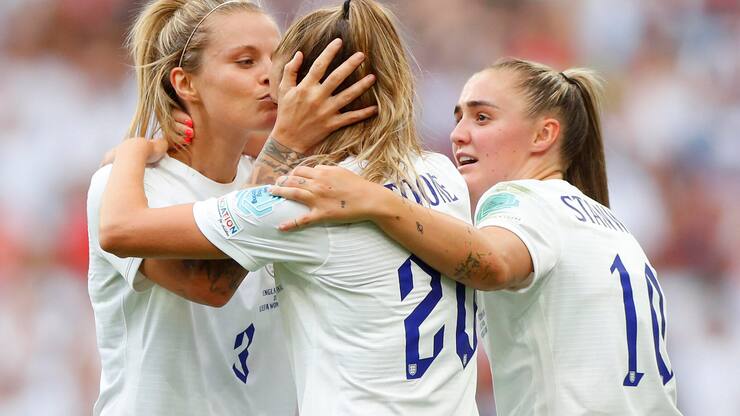 LONDON, ENGLAND - JULY 31: Ella Toone of England celebrates with teammates Rachel Daly and Georgia Stanway after scoring their team's first goal during the UEFA Women's Euro 2022 final match between England and Germany at Wembley Stadium on July 31, 2022 in London, England. (Photo by Lynne Cameron - The FA/The FA via Getty Images)