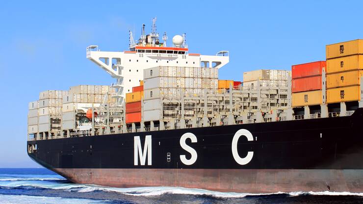 Container ship sailing close to the city of Alicante., Big container ship of MSC Company approaching to Alicante city in Spain for download cargo.